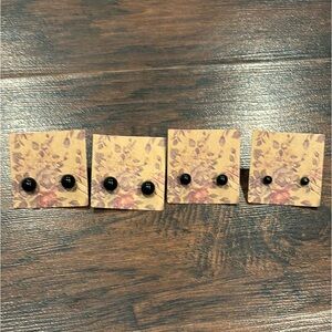 Four pairs of black earrings
